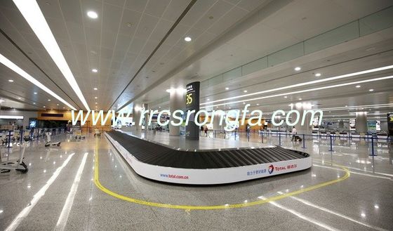 Baggage reclaim carousel. inclined rubber slat inclined claim conveyor. carousel slat
